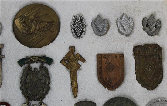 A collection of thirty two Hitler Youth pin badges and other day badges,